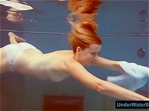 red-haired in a white dress and spectacular bathing suit